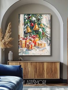 a living room scene with focus on the christmas tree and presents under the bell painting