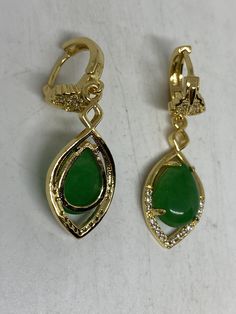 Delicate and detailed nephrite Jade and stone and white bronze gold rhodium earrings Chinese letter for luck These earrings are about an inch long All jewelry is shipped in a nice gift box. Check out our over a THOUSAND great reviews Teardrop Jade Earrings For Formal Occasions, Jade Drop Earrings For Anniversary, Green Lever Back Earrings As A Gift, Pierced Green Gold-plated Earrings, Green Gold-plated Pierced Earrings, Green Gold-plated Earrings, Gold Jade Gemstone Earrings, Elegant Jade Earrings Gift, Gold Gemstone Clip-on Earrings As Gift