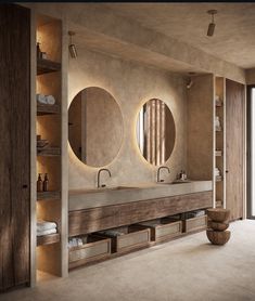 a bathroom with two sinks and mirrors on the wall next to a large open door