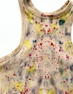 Top dyed with flowers Spring Cotton Bleached Tops, Bohemian Acid Wash Cotton Tops, Acid Wash Cotton Tops For Summer, Sleeveless Cotton Tops With Natural Dye, Sleeveless Cotton Top With Natural Dye, Summer Cotton Top With Paint Splatter, Summer Cotton Tops With Paint Splatter, Tie Dye Floral Print Summer Top, Tie Dye Floral Print Top For Summer