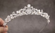 "Pearl & Crystal Wedding Tiara, Bridal Tiara, Pearl Wedding Headpiece, Pearl Wedding Tiara, Crystal Wedding Crown, Bridal Headpiece This elegant and sparkle rhinestone Tiaras is perfect for your wedding or formal night out. This Tiaras is flexible. It will be perfect for the bride. The Metal Headband measured approx. 14\" long. The rhinestone part of the headband is about 9\" long and the center is 1.25\" high. Tone color: Silver tone, Gold tone and Rose gold tone. Pearl color : Swarovski wh Small Tiara Wedding Bridal Hair, Vintage Wedding Tiara, Pearl Tiara Wedding, Princess Tiaras, Tiara Bride, Pearl Headpiece Wedding, Prom Tiaras, Crystal Headpiece Wedding, Tiara Silver