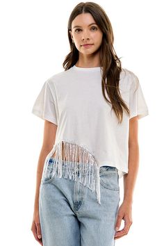 Cotton, short sleeve t-shirt with side embellished fringe detail. Graphic Tee With Frayed Hem And Short Sleeve, Casual Cotton T-shirt With Fringe, Cotton Fringe Tops For Spring, Spring Cotton Tops With Fringe, Summer Short Sleeve Tops With Frayed Hem, Casual Short Sleeve Fringe T-shirt, White Cotton Fringe Tops, Trendy T-shirt With Frayed Hem For Summer, Trendy Frayed Hem T-shirt For Summer