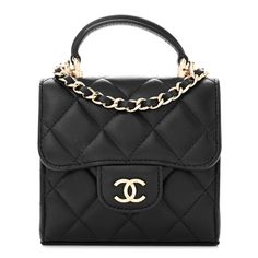 This is an authentic CHANEL Lambskin Quilted Top Handle Flap Clutch With Chain in Black. This stylish bag is crafted of luxuriously soft diamond quilted calfskin leather in black. The bag features a gold chain leather threaded shoulder strap and a facing flap with a small gold Chanel CC logo. The flap opens to a black fabric interior with card slots. Quilted Top, Gold Chanel, Leather Thread, Diamond Quilt, Cc Logo, Stylish Bag, Leather Chain, Black Fabric, Gold Chain