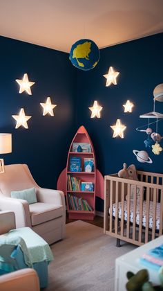 a baby's room decorated in blue and white with stars on the wall