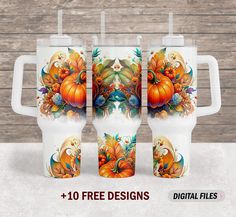 three coffee mugs with pumpkins and leaves on them, all decorated in different designs