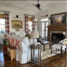 a living room filled with furniture and a fire place