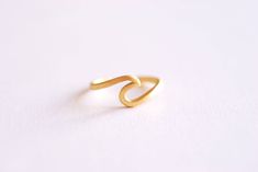 Matte Gold Adjustable Wave Ring- nalu ring, ocean ring, tidal wave ring, beach jewelry, ocean jewelry, nautical surf ring, Adjustable ring, - Ring size adjustable for sizes 6-9 US - 925 Stamp ☑ Quantity: 1 piece ☑ Approximate Measurements: adjustable for sizes 6-9 US ☑ Surface: Matte Finish ☑ Material: Vermeil Gold: 22k Gold plated over 925 Sterling Silver ☑ Made in Los Angeles, California USA ☑ This charm does come in larger quantities than listed. Please message me for a custom wholesale amoun Minimalist Toe Ring Jewelry For Beach, Minimalist Beach Ring Jewelry, Minimalist Beach Jewelry Ring, Adjustable Wavy Rings As A Gift, Ocean Ring, Jewelry Ocean, Tidal Wave, Ocean Jewelry, Wave Ring