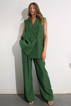 Unleash your inner style maven with the Mulla May Set. This stylish set features a long vest with a flattering belt and button closure, paired with long pants and a wide leg for ultimate comfort and fashion. Perfect for any occasion, this set will elevate your wardrobe (and your confidence)! Green Floor-length Spring Sets, Green Wide Leg Sets With Pockets, Spring Wide-leg Pants Sets With Pockets, Green Wide-leg Sets, Green Wide-leg Beach Sets, Long Vest, Office Chic, Long Vests, Crop Top Sweater