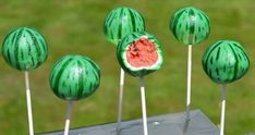 some watermelon lollipops sitting on top of each other