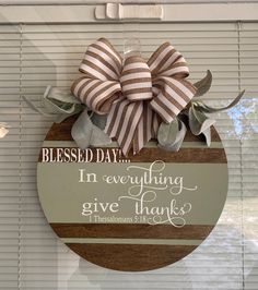 a wooden plaque hanging on the side of a window that says, i'm everything give thanks