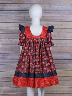 "Girls Fall Dress with Pumpkins and Flowers! Toddler Pumpkin Dress is perfect for all Fall Long not just for Halloween Parties and School Parties. This Short Sleeve fall dress with cute Flutters is perfect for the Pumpkin Patch. Make this into an outfit by adding matching ruffle pants, bloomers or pantaloons as well as a hair piece. This dress is available from Newborn through Teen Girls Size 14! There are no closures on this jumper style dress. Handmade Made USA by me! Dress Pictured is a 6 All Create Kids Couture, Cotton Frocks For Kids, Frocks For Kids, Girls Fall Dresses, Pumpkin Dress, African Dresses For Kids, Jumper Style, Girls Fall, Ruffle Pants