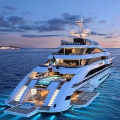 a large white boat floating on top of the ocean