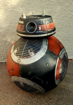 a star wars bbq helmet sitting on the ground