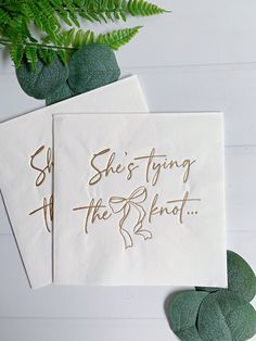 two greeting cards with gold foil on them, one says she's tying the knot