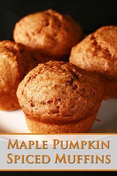 some muffins on a plate with the words maple pumpkin spiced muffins