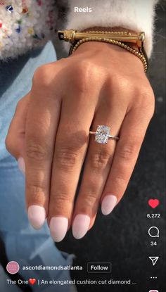 a woman's hand with a diamond ring on it and the words, i love you