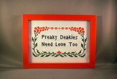 there is a red frame with a cross stitch pattern on it that says, fiery daisies need love too