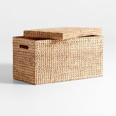 an empty basket sitting on top of a white surface