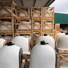 several large white tanks sitting next to each other