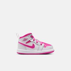 Style No. FD8782-500 Color: White/Iris Whisper/Fire Pink Pick pink for the win! This pair pops to life with a bright mix of rosy hues. All the classic Jordan comforts are there too: foam in the sole for a cushioned step, and that sturdy rubber cupsole for comfort. Jordan 1 Mid Baby/Toddler Shoes. Baby Jordans, White Iris, Kids Jordans, Jordan 1 Mid, Toddler Shoes, Baby Fever, Jordan Shoes, Jordan 1, Air Jordan