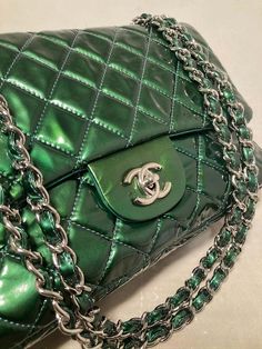 For Sale on 1stDibs - Chanel Metallic Green Patent Leather Jumbo Classic Flap in excellent condition. Metallic green quilted patent leather exterior trimmed with silver hardware Woven Chain, Gold Ounce, Color Tones, Exterior Trim, Cc Logo, Dust Cover, Classic Flap, Green Leather, Leather Interior