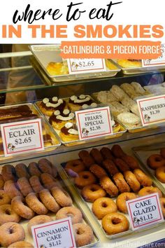 there are many different types of doughnuts in the display case at this store