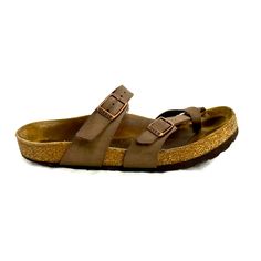 Birkenstock!! This Birkenstock Mayari Women's Size Eu 38 / Us 7-7.5 Mocha Brown Birko Flor Thong Flat Sandal Is Ready For All Of Your Adventures. The Molded Footbed Will Cradle Your Foot And The Logo Buckles Give It Plenty Of Style. Good Condition. Normal Wear Including Discoloration On Footbed. Right Shoe At Back Sole Has A Worn Edge (See Last 2 Pics). This Is A Pre-Owned Item And May Have Fading Or Discoloration, Marks Or Stains, Scratches, Wrinkling, Wear On Straps, Corners, Trim And Texture. Casual Toe Loop Flip Flops For Everyday, Casual Toe Loop Flip Flops, Brown Toe Post Sandals For Everyday, Casual Brown Flip Flops For Everyday, Casual Everyday Brown Flip Flops, Everyday Brown Toe Loop Sandals, Brown Flip Flops With Textured Footbed, Adjustable Brown Flat Flip Flops, Brown Leather Footbed Flip Flops For Everyday Wear