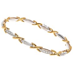 This brilliant line bracelet is crafted from 18K yellow and white gold. The alternating links of this bracelet display yellow gold crosses and white gold bars. The white gold bar links are set with brilliant cut diamonds creating a dazzling shine. The diamonds are approximately 0.32 TCW. Box style clasp with safety latch. Marks: 18K IRU Dimensions: 7 3/8" L x 1/4" W Weight: 18.8 Gross grams Luxury White Gold Bracelet With Intricate Design, Gents Bracelet, Diamond Bracelet Design, Modern Gold Jewelry, Gold Bars, Bracelet Tennis, Gold Link Bracelet, Bracelet Display, Bracelets Gold Diamond