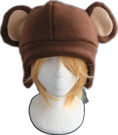 a brown bear hat on top of a white mannequin head