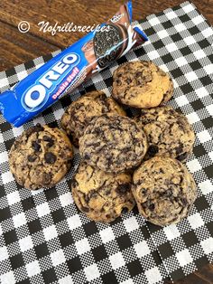 chocolate chip cookies and oreo on a checkered tablecloth with an oreo bar