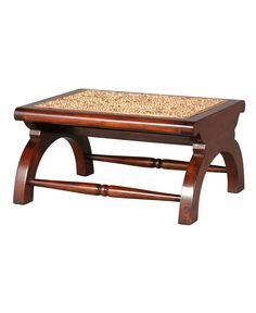 a coffee table with a wooden frame and cork top on an isolated white background for display