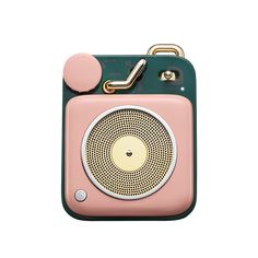 a small pink and green radio with a metal handle on it's side, against a white background