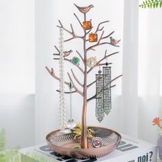 a jewelry tree is sitting on top of a box