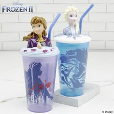 two frozen drink cups sitting next to each other