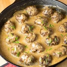 meatballs and gravy are in a skillet