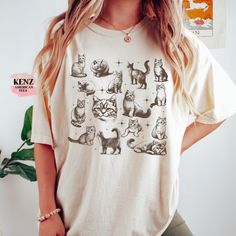 Vintage 90s Tattoo Cat Tshirt, Retro Kitten Nature Shirt, Cat Lovers Gift, Cats In Space Unisex Relaxed Adult Graphic Tee, Funny Gifts Browse our selection of more shirts/sweatshirts ------ https://www.etsy.com/shop/KenzAmericanTee?ref=seller-platform-mcnav ✿ Shirt Material We use the finest Unisex short sleeve shirts * 100% combed and ring-spun cotton Guaranteed to be your Favorite daily Shirts ✿ Design Printing DTG/DTF printer for crisp printing, we don't use cheap quality vinyl. Using high-qu Frog Tshirt, Retro Guitar, Cats In Space, Guitar Shirt, Gatto Carino, Retro Country, Tattoo Cat, Dtf Printer, Nature Shirts