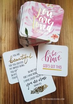 four coasters that say you are loved and have the same message on each one