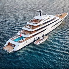 a large white boat floating on top of the ocean