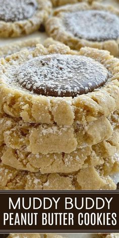 a stack of peanut butter cookies with the words muddy buddy on top and below it