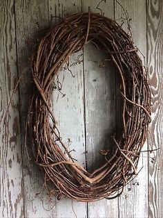 a close up of a wreath on a wooden wall