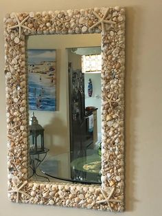 there is a mirror that has shells on it