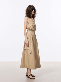 MO&Co. Women's Long Line Cargo Dress Feel stylish and comfortable in our maxi dress. Made from soft cotton fabric, its flowy silhouette and non-adjustable straps provide a flattering fit. With snap multiple cargo pockets and comes with a belt, it's practical and versatile. This style of dress is comfortable and casual, making it a great option for everyday wear or travel. Features : - Long line flowy silhouette- Non-adjustable straps, snap button closure- Multiple cargo pockets, belt included Co Beige Cotton Midi Dress With Pockets, Chic Maxi Dress With Pockets And Spaghetti Straps, Chic Maxi Dress With Spaghetti Straps And Pockets, Chic Cotton Maxi Dress With Pockets, Khaki Sleeveless Dress With Pockets, Casual Beige Maxi Dress With Tie Straps, Beige Casual Maxi Dress With Tie Straps, Spring Beige Maxi Dress With Pockets, Casual Beige Maxi Dress With Pockets