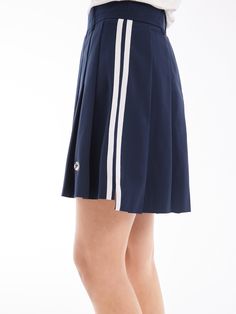 Details: Girly Pleated Skirt In NavyBuilt-in shorts for a discreet summer lookStriped webbing at the side for a vintage college look. Materials & Care: Fabric: Polyester 100%.Lining: nylon 92.4 %Spandex 7.6 % Hand wash | Dry clean Do not bleach Size & Fit: Model is 5'7", Bust 32, Waist 24, Hips 35, wearing a size S Item #: SN2SK10 Casual Knee-length Tennis Skirt For Summer, Knee-length Casual Tennis Skirt, Casual Knee-length Summer Tennis Skirt, Navy Sporty Skort For Summer, Classic Short Skort For Summer, Preppy Fitted Short Skort, Navy Casual Tennis Skirt, Casual Navy Pleated Skort, Navy Casual Pleated Skirt Skort