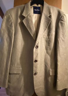 This is worn just once. Like-new, excellent condition. Nautica for Lord & Taylor model. 3 button closure, decorative buttons on the sleeves. Two inside pockets. Inside liner is silk.  60% Linen & 40% Cotton. Excellent year round weight.  Original Price: $395 Casual Semi-formal Sport Coat With Single Button, Designer Sport Coat With Notch Lapel And Button Closure, Formal Solid Sport Coat With Buttons, Solid Color Sport Coat With Buttons For Formal Occasions, Solid Sport Coat With Buttons For Formal Occasions, Formal Sport Coat With Buttons, Formal Solid Sport Coat With Button Closure, Formal Sport Coat With Button Closure, Casual Sport Coat For Business Casual