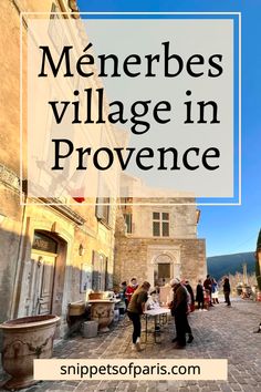 people walking around in an old town with text overlay that reads menerbes village in provence