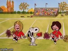 peanuts cheerleaders on the football field with their dog and cheerleaders holding pom poms