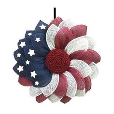 a red, white and blue flower with stars on it