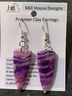 Handcrafted polymer clay earrings. Lightweight and suitable to wear with many different style outfits. The design has been created with translucent clay to make a purple faux crystal  and sealed with resin to protect the surface and add shine Size approximately 3.5x1.5cms. Drop from top of wire 5.5cms Silver plated earring wires  Number 24 purple translucent faux crystal Unique Purple Earrings With Ear Wire, Unique Single Purple Earring, Hand Painted Resin Earrings As Gift, Hand Painted Resin Earrings For Gifts, Unique Hand Painted Purple Earrings, Hand Painted Purple Earrings As Gift, Trendy Resin Earrings As Gift, Handmade Trendy Lavender Jewelry, Handmade Purple Crystal Drop Earrings