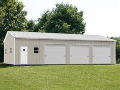 two garages in the middle of a grassy field