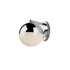 a chrome and white ball mounted on a wall